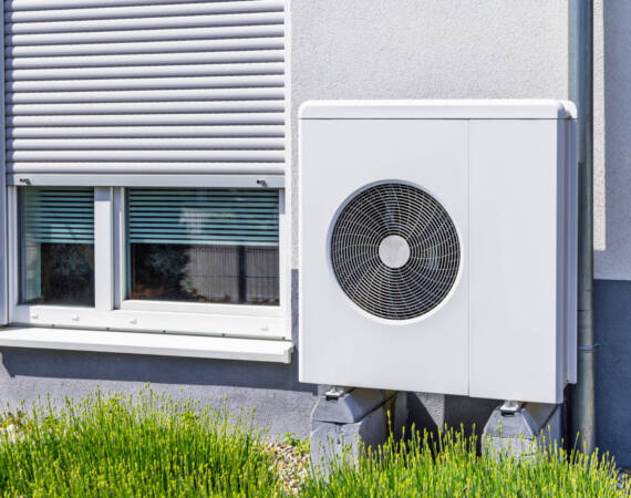 New  air source heat pump installed outside of family house